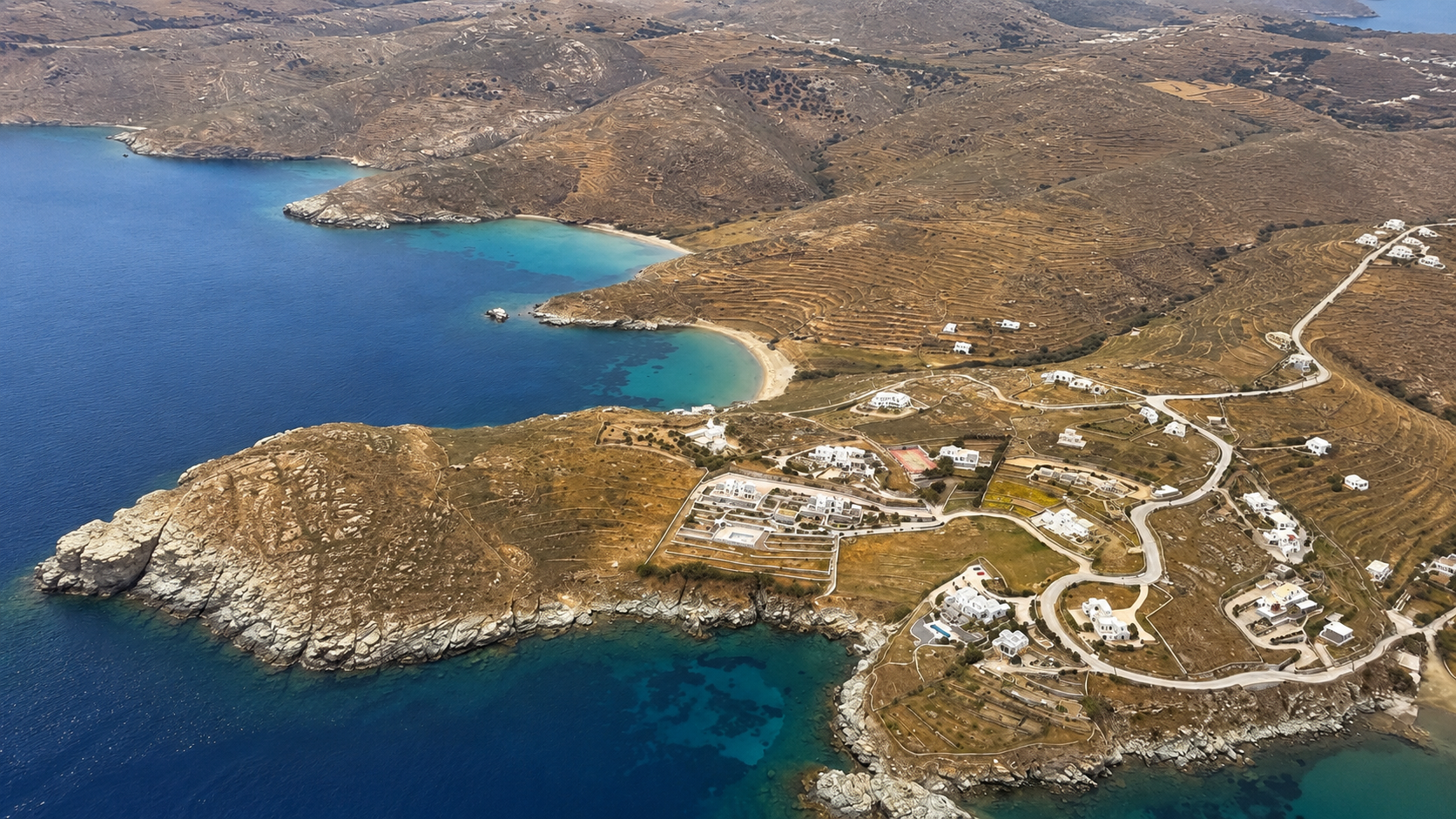 Aerial view of Patmos island coastline and bays seen from a helicopter over the Aegean Sea in Greece