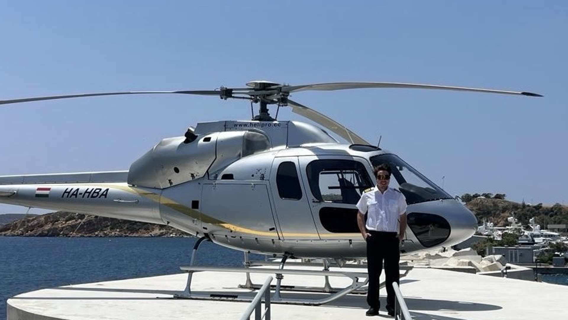 Raphael Seebacher operations support coordinating private helicopter movement on seaside helipad in Greece for Fly G Aviation